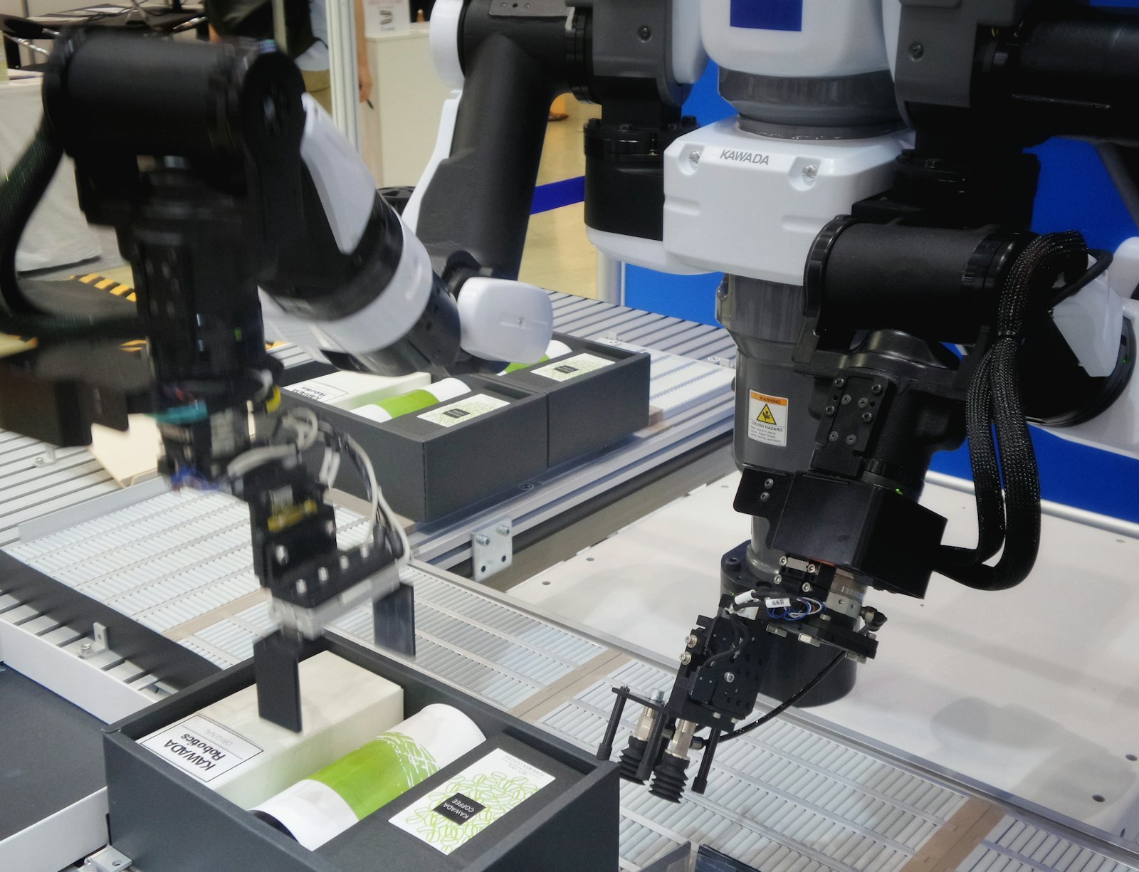 Robotic arms on an automated production line