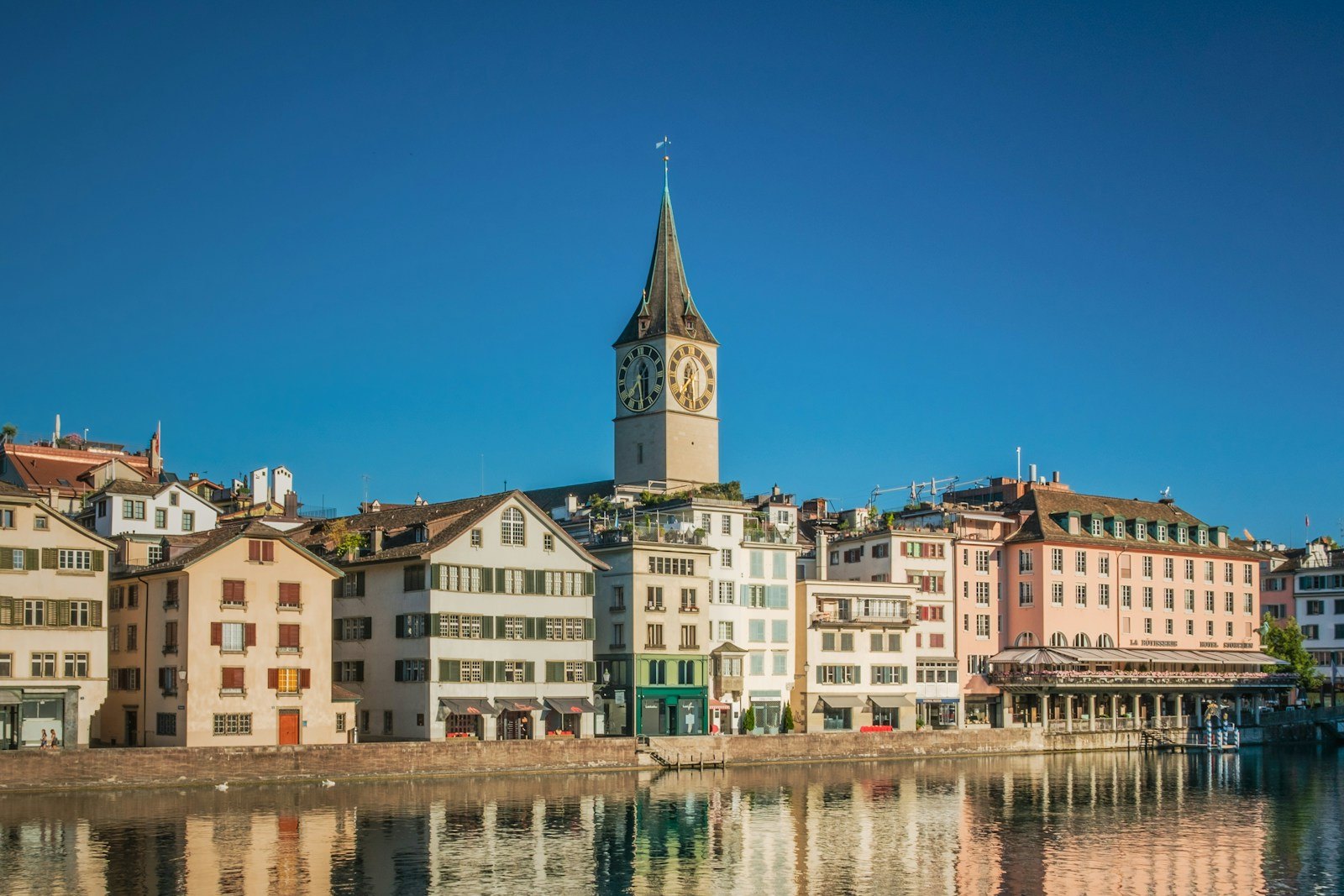 St. Peter’s Church clock tower above the Limmat in Zurich’s old town